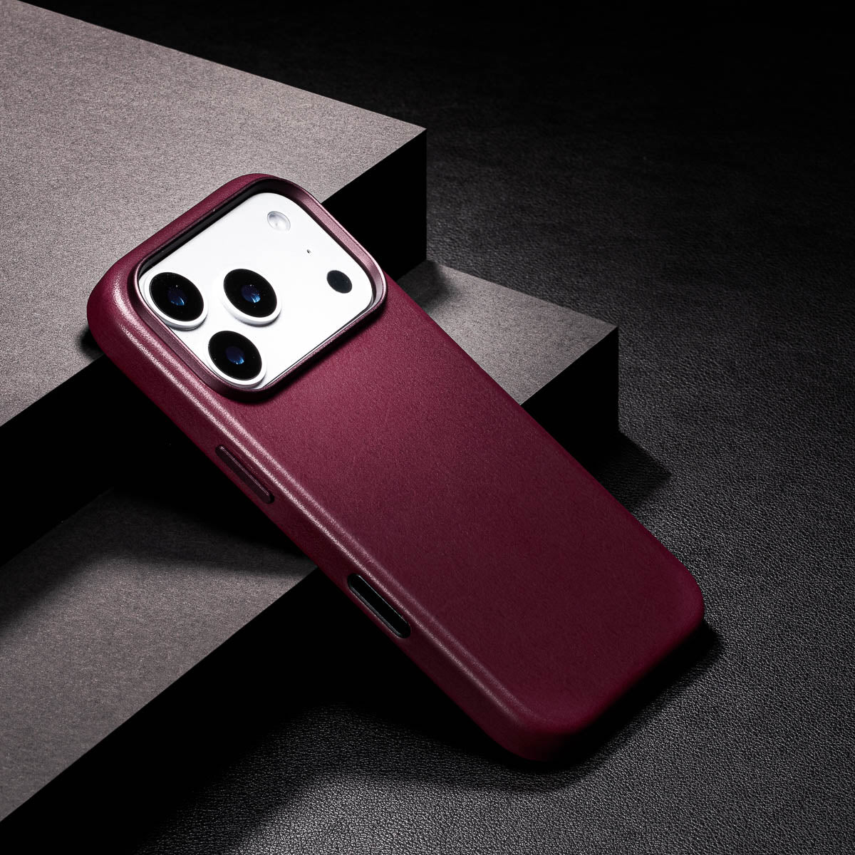 close up of precision milled metal camera frame on iphone 18 pro max leather case in burgundy