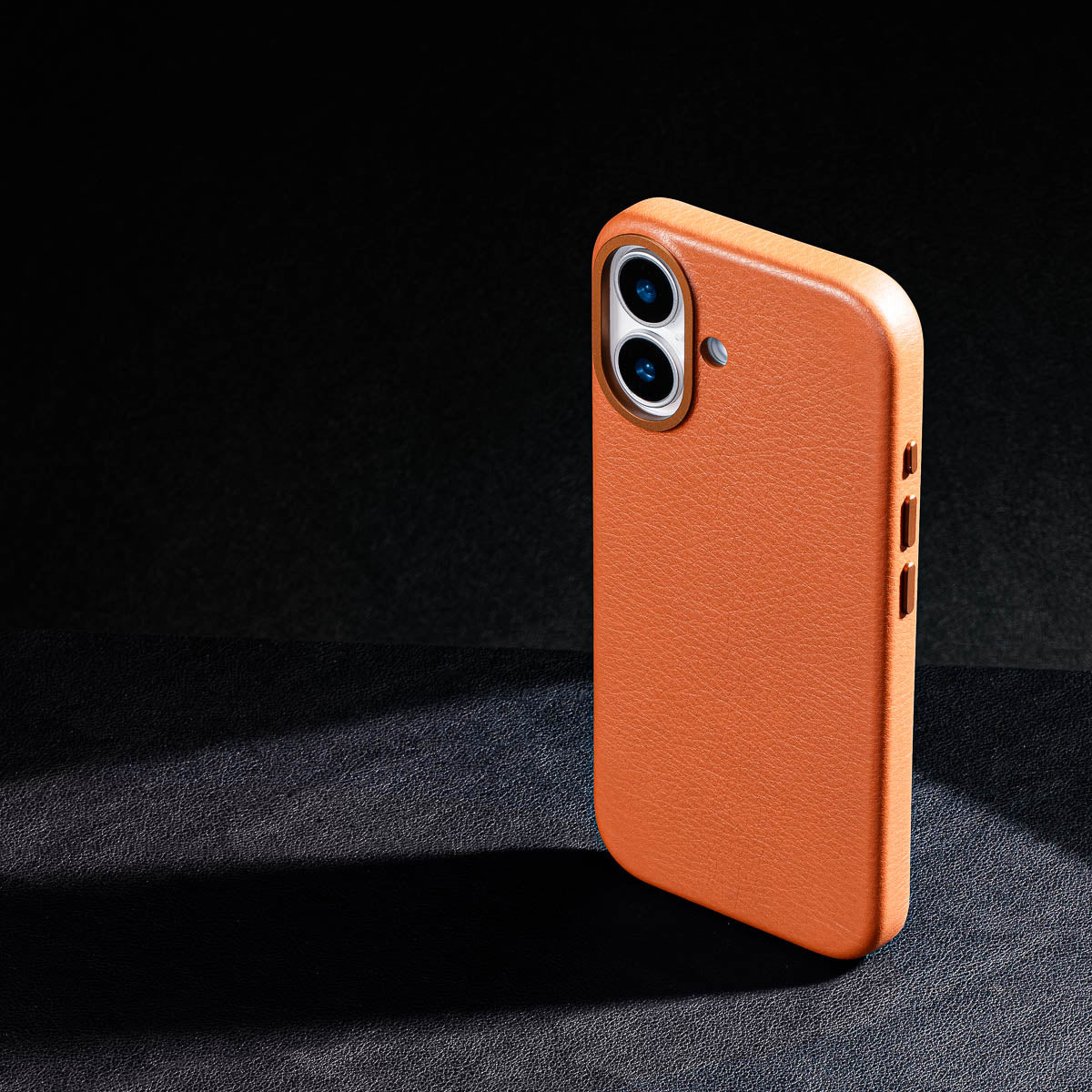 iphone 17 leather case in cognac brown Ð raised camera ring and colour matched metal buttons detailing