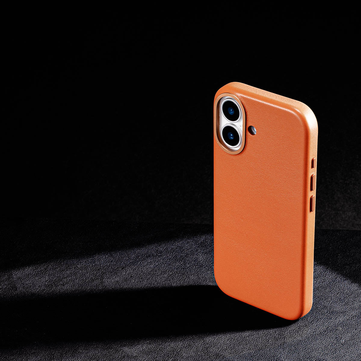 iphone 17 leather case in cognac brown - raised camera ring and colour matched metal buttons detailing