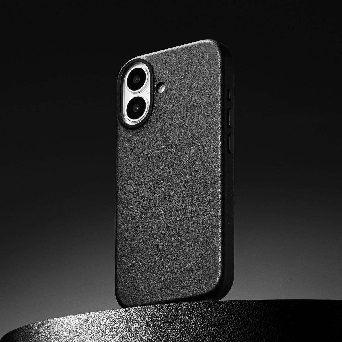 close up of obsidian black leather case for iphone 17 showing full grain italian leather texture