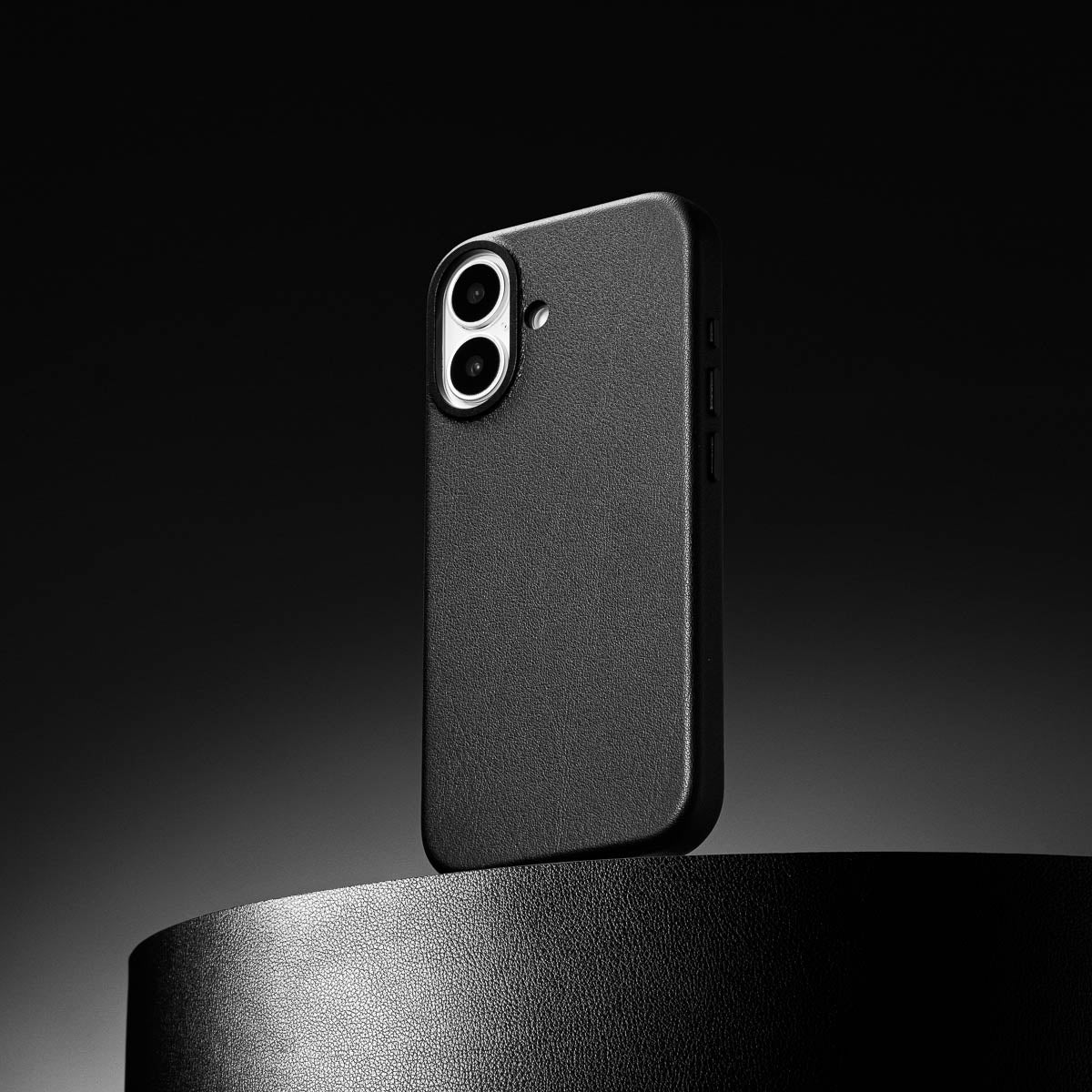 close up of obsidian black leather case for iphone 17 showing full grain italian leather texture