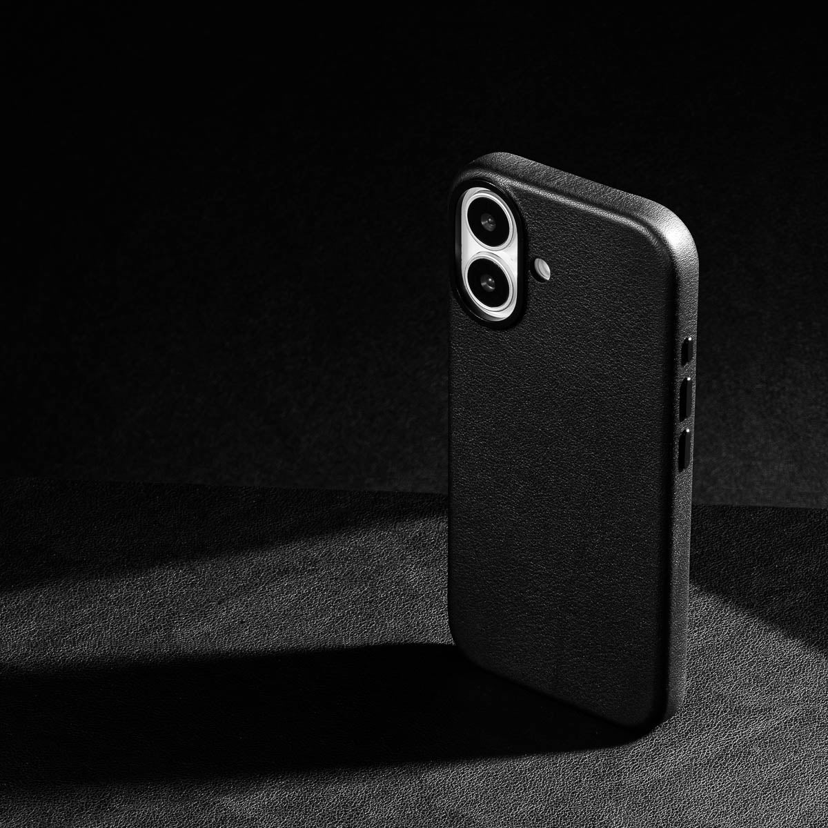 iphone 17 leather case in obsidian black Ð raised camera ring and colour matched metal buttons detailing