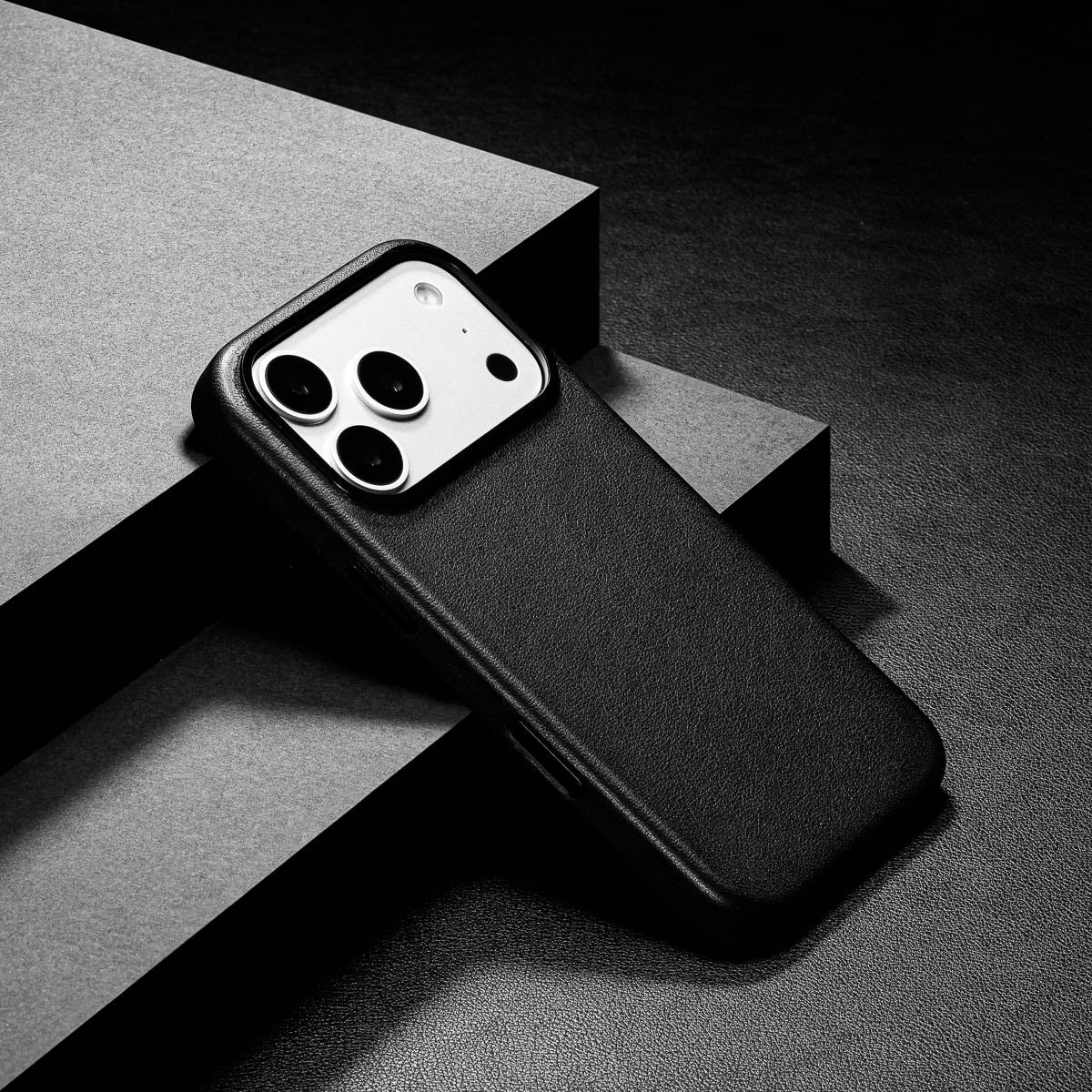 slim obsidian black iphone 17 pro leather case showing thin profile and curved edges
