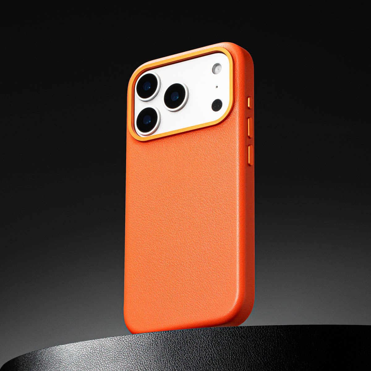 close up of solar orange leather case for iphone 17 pro showing full grain italian leather texture