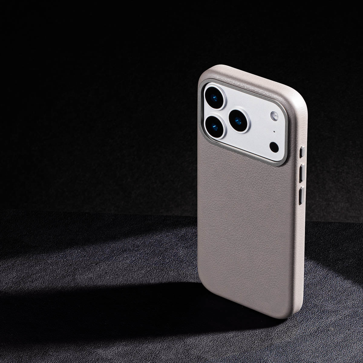 iphone 17 pro leather case in stone grey - raised camera ring and colour matched metal buttons detailing
