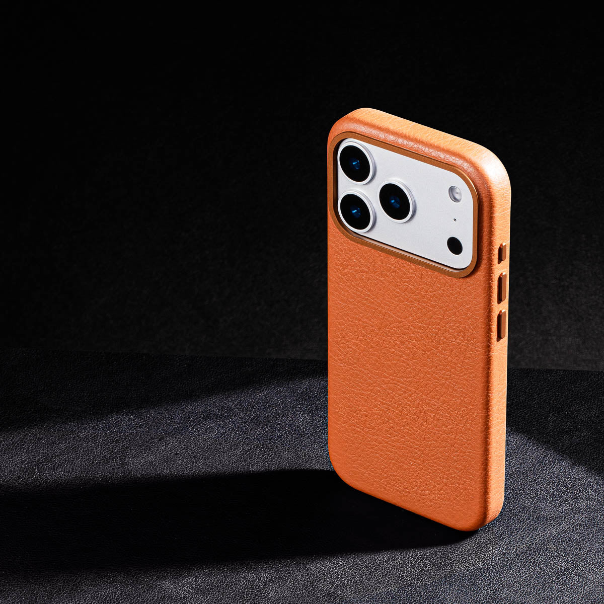 iphone 17 pro max leather case in cognac brown Ð raised camera ring and colour matched metal buttons detailing