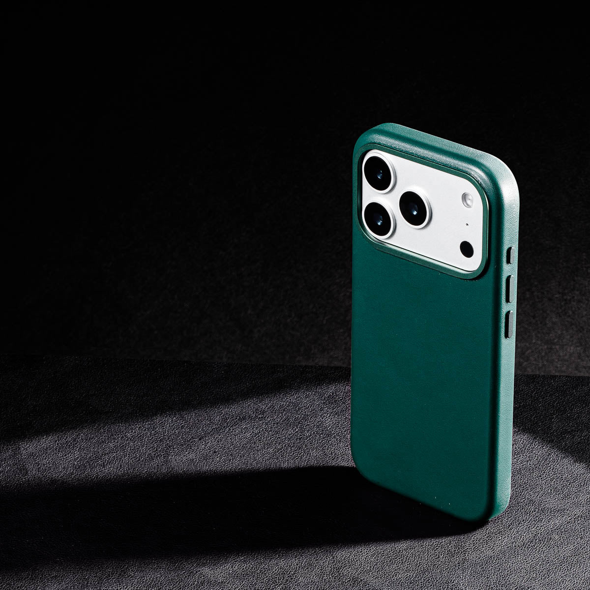 iphone 17 pro max leather case in racing green - raised camera ring and colour matched metal buttons detailing