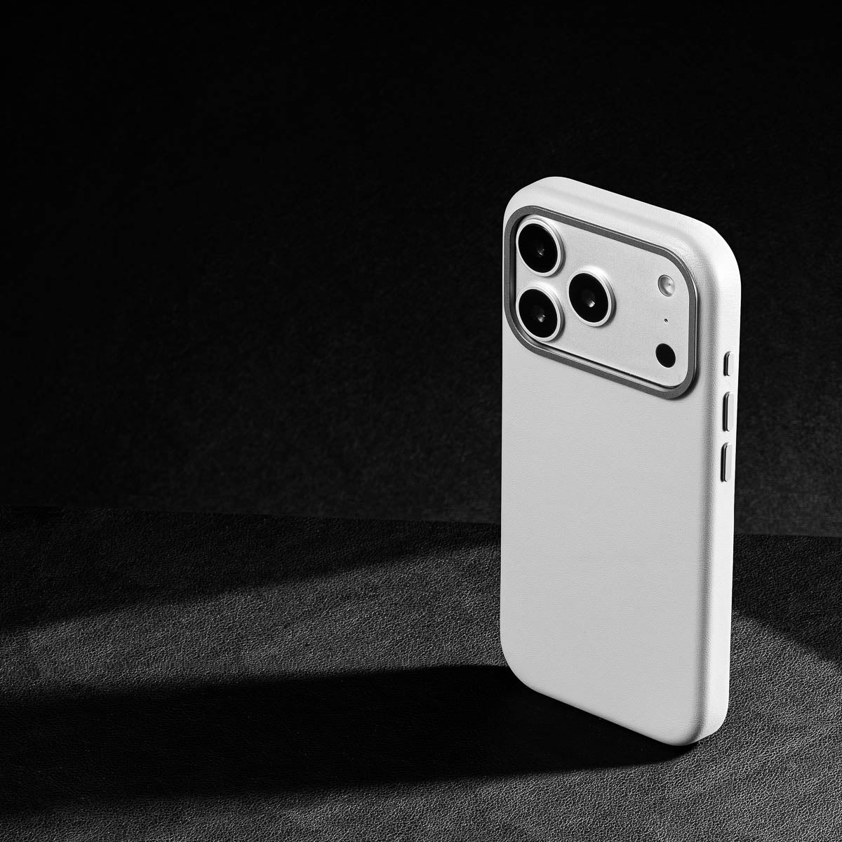 iphone 17 pro max leather case in stone grey - raised camera ring and colour matched metal buttons detailing