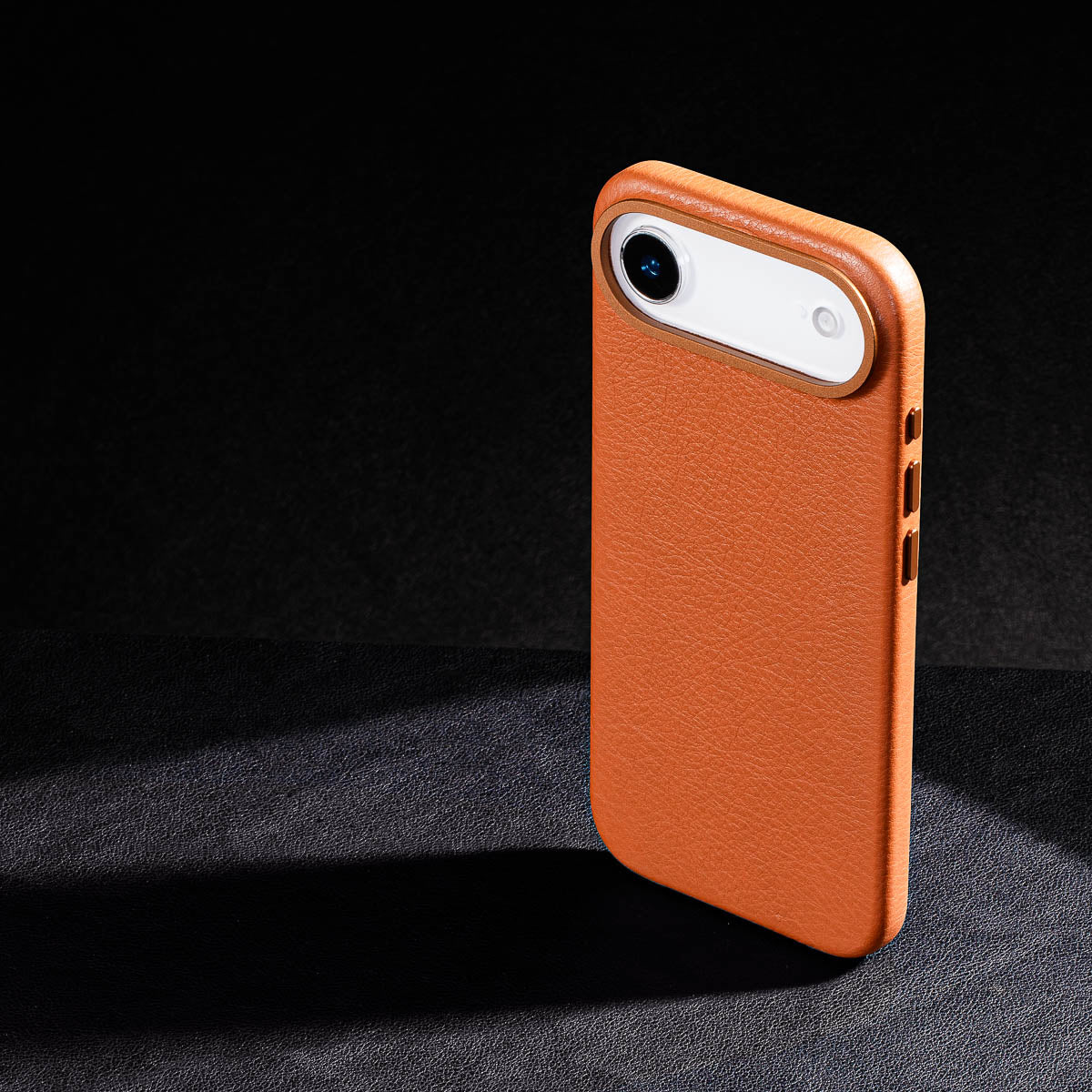 iphone air leather case in cognac brown Ð raised camera ring and colour matched metal buttons detailing