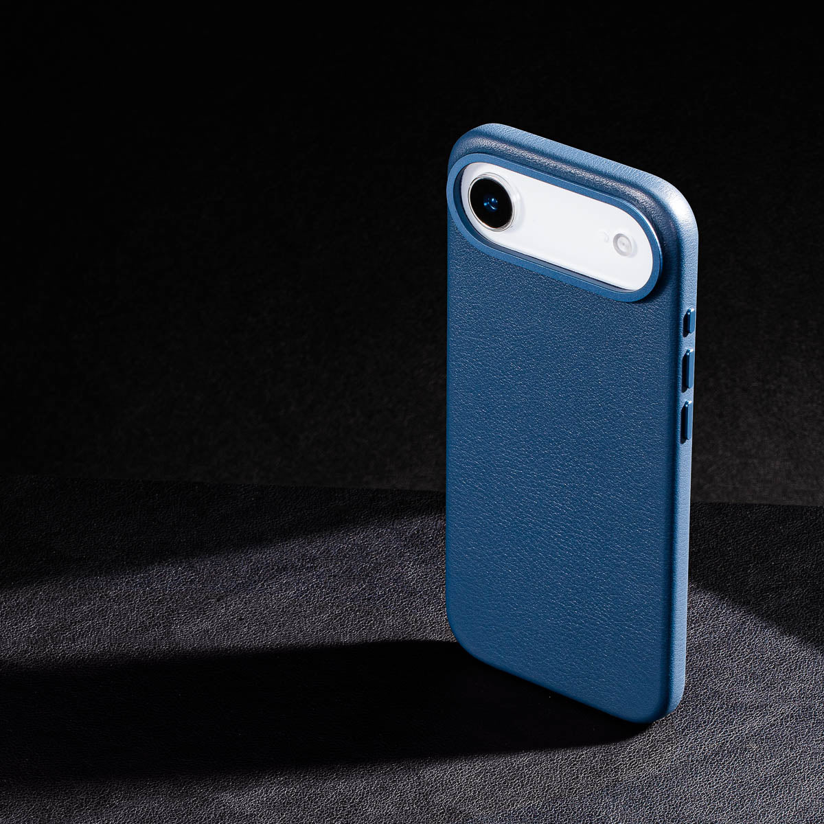 iphone air leather case in steel blue Ð raised camera ring and colour matched metal buttons detailing