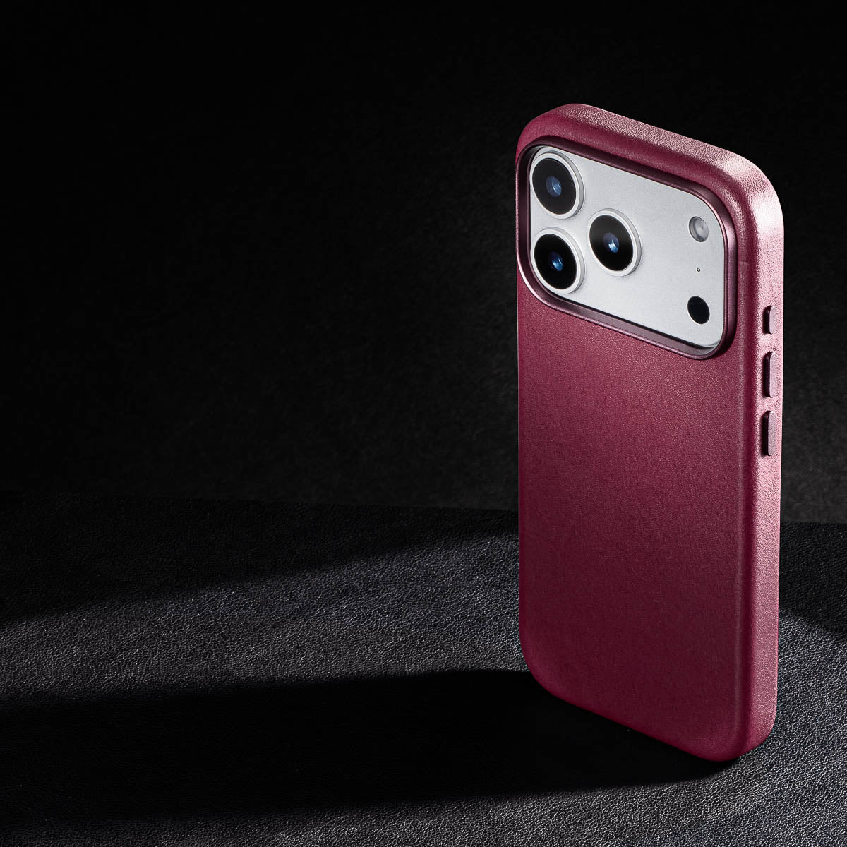 rear three quarter view of burgundy vachetta leather iphone 18 pro case