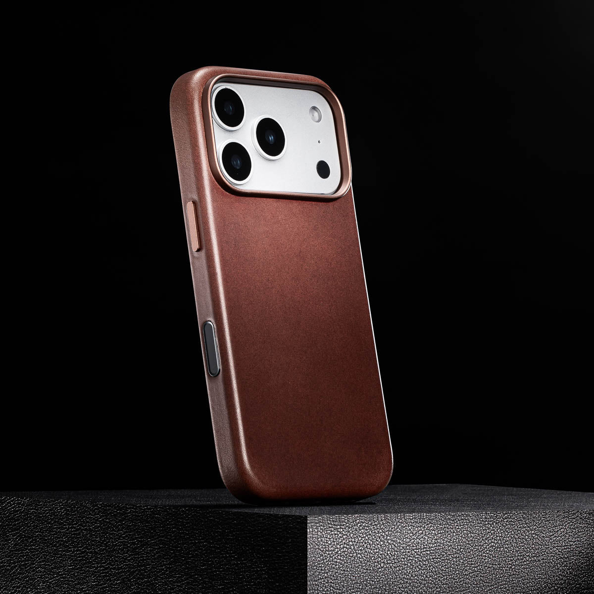 side view of dark brown iphone 18 pro leather case with colour matched metal buttons and camera control button