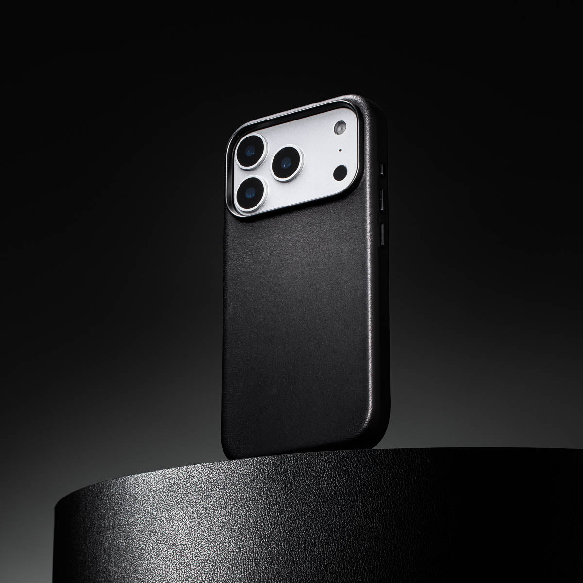 noir black leather iphone 18 pro case standing upright showing slim profile and curved edges