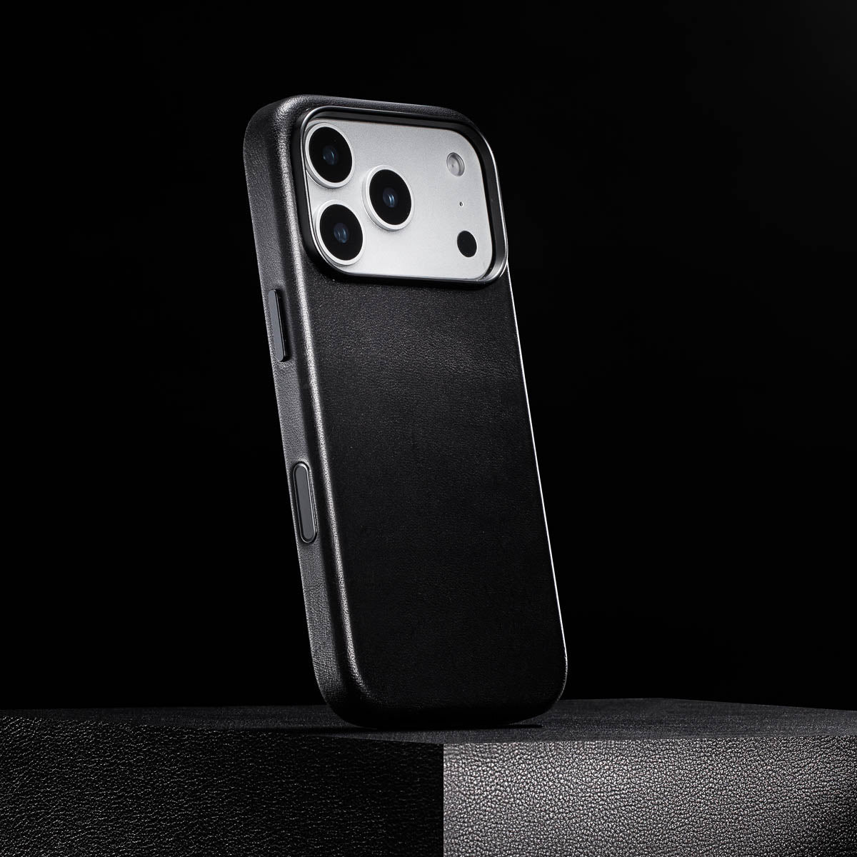 side view of noir black iphone 18 pro leather case with colour matched metal buttons and camera control button