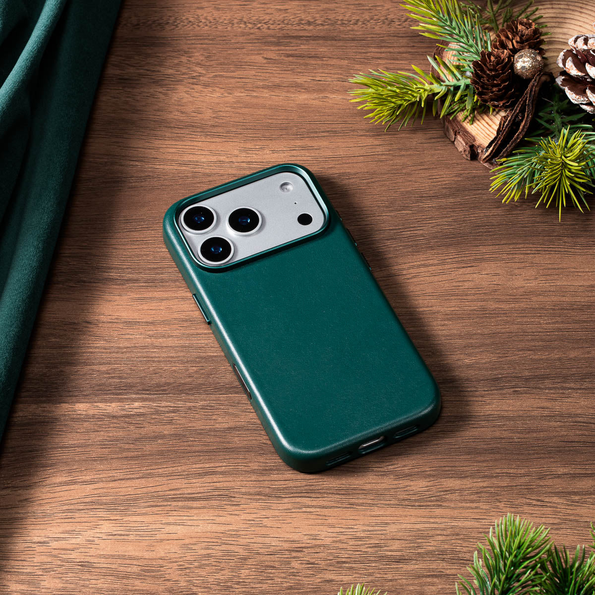 racing green nappa leather case for iphone 18 pro lying flat on wooden desk