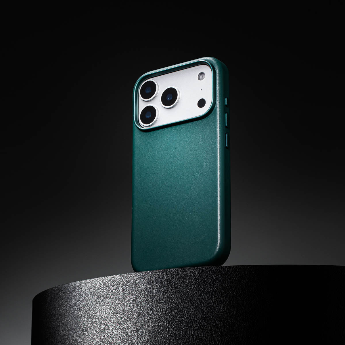 racing green leather iphone 18 pro case standing upright showing slim profile and curved edges