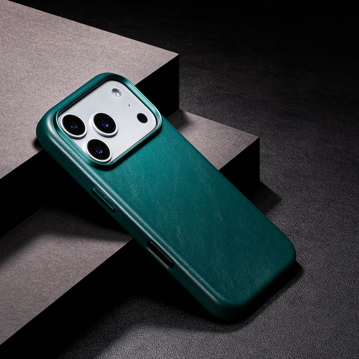 close up of racing green iphone 18 pro leather case camera frame and full grain leather texture