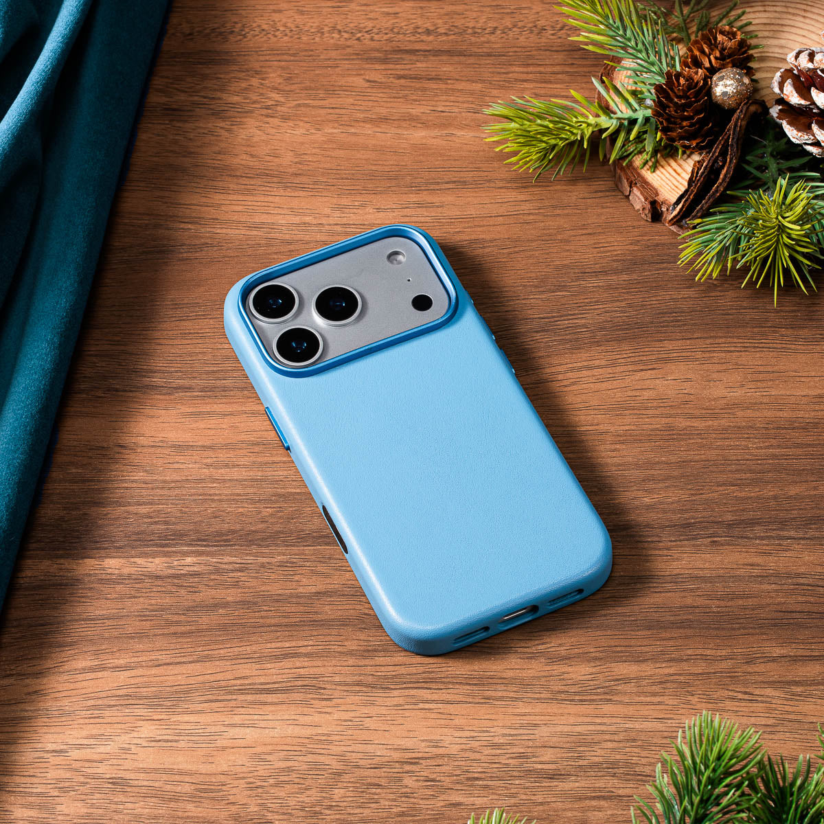 sky blue nappa leather case for iphone 18 pro lying flat on wooden desk