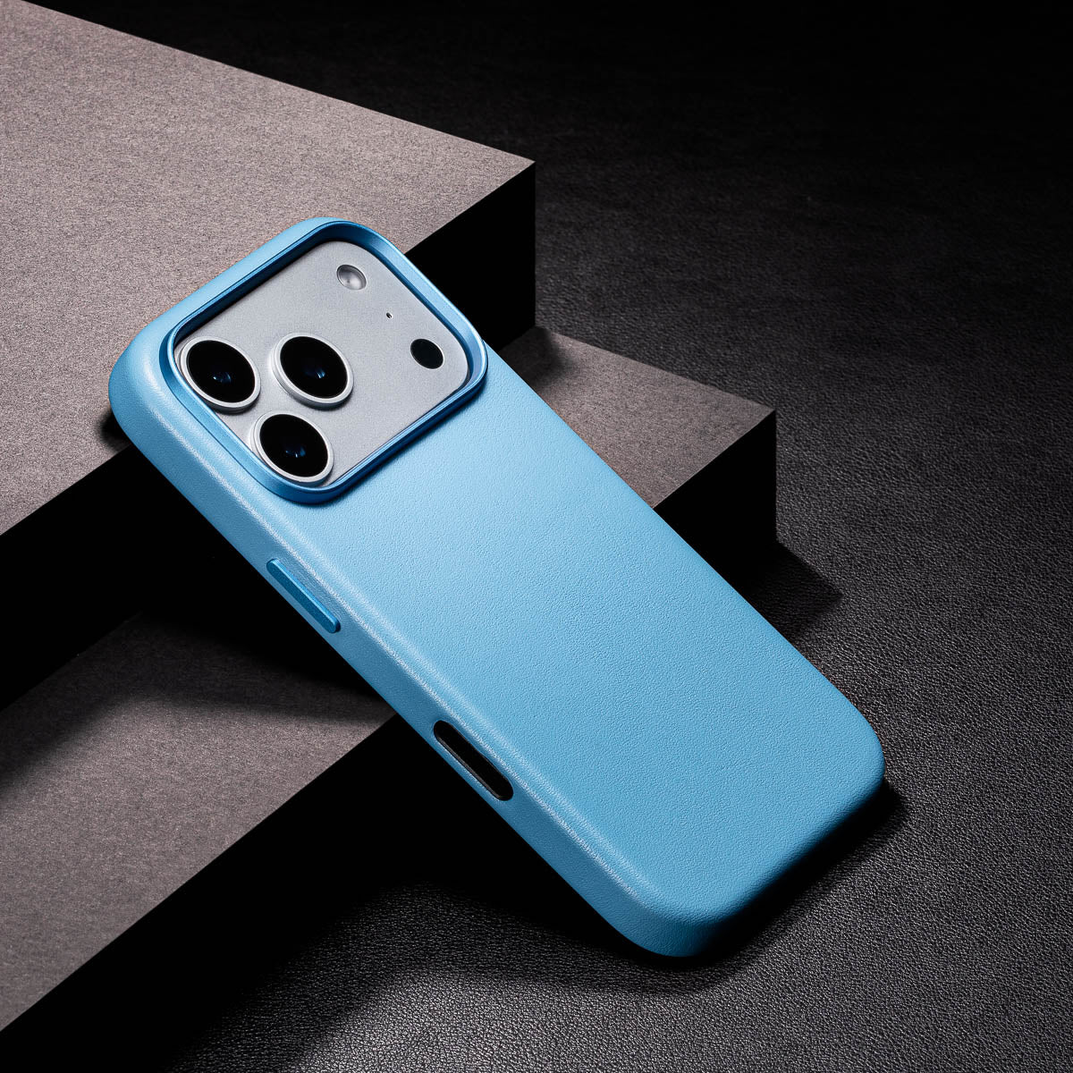 close up of sky blue iphone 18 pro leather case camera frame and full grain leather texture