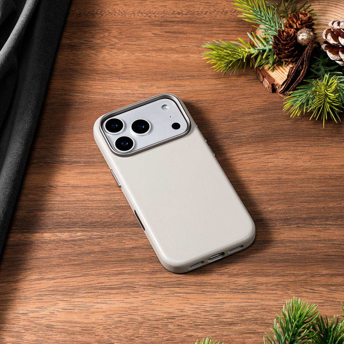 stone grey nappa leather case for iphone 18 pro lying flat on wooden desk