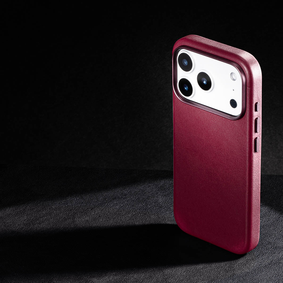 rear three-quarter view of cherry vachetta leather case for iphone 18 pro max showing raised camera ring