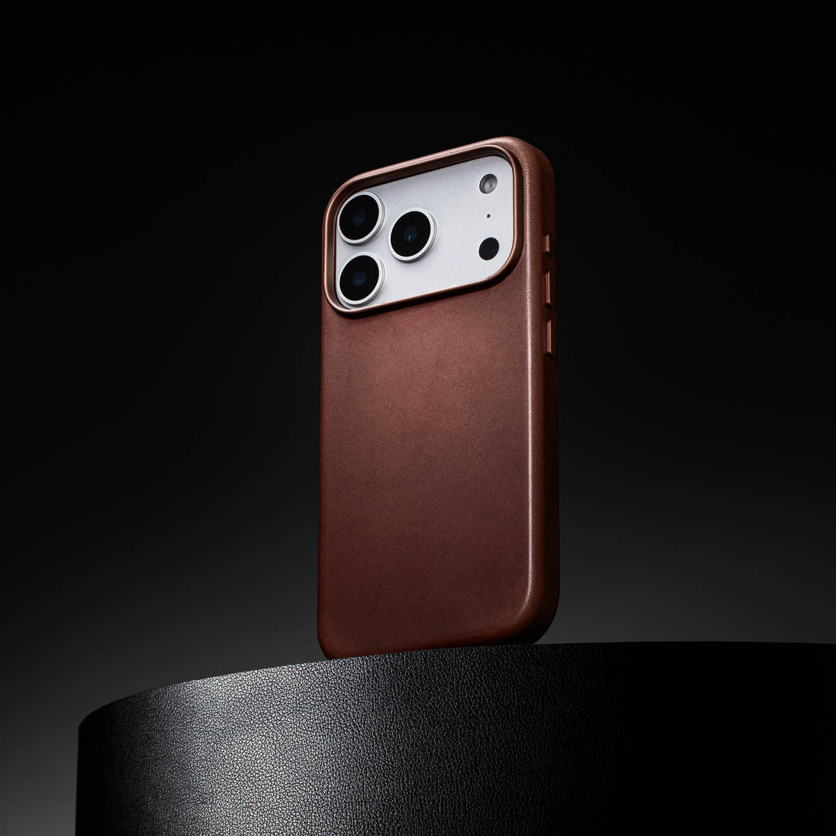 dark brown leather iphone 18 pro max case standing upright showing slim profile and curved edges