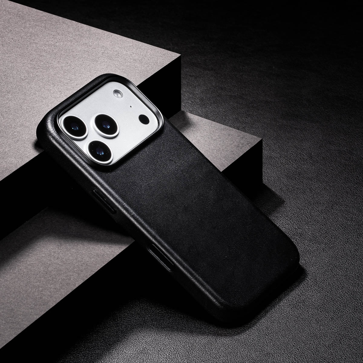 close up of noir black iphone 18 pro max leather case camera frame and full grain vachetta texture