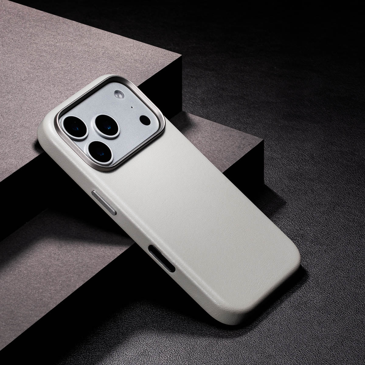 close up of stone grey iphone 18 pro max leather case camera frame and full grain leather texture