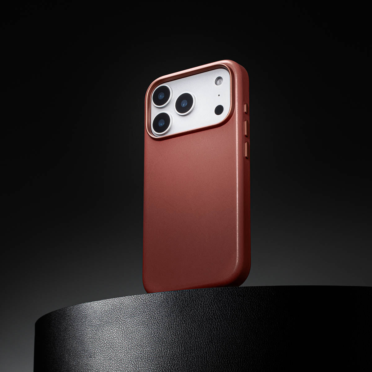 umber leather iphone 18 pro max case standing upright showing slim profile and curved edges