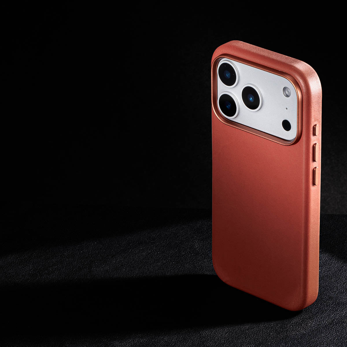 rear three-quarter view of umber vachetta leather case for iphone 18 pro max showing raised camera ring