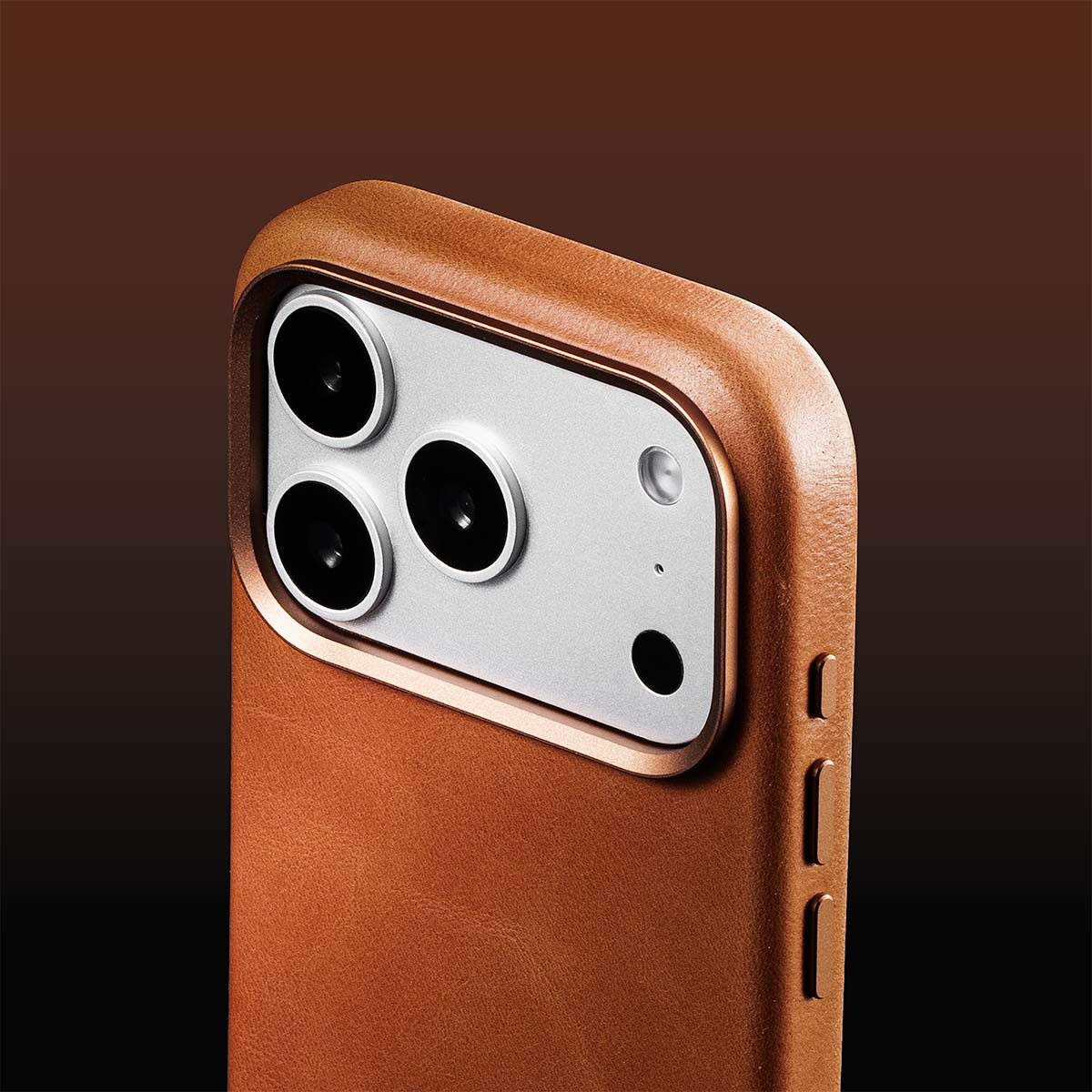 Brown iphone 17 pro max leather case with camera module on a brown background with rich patina