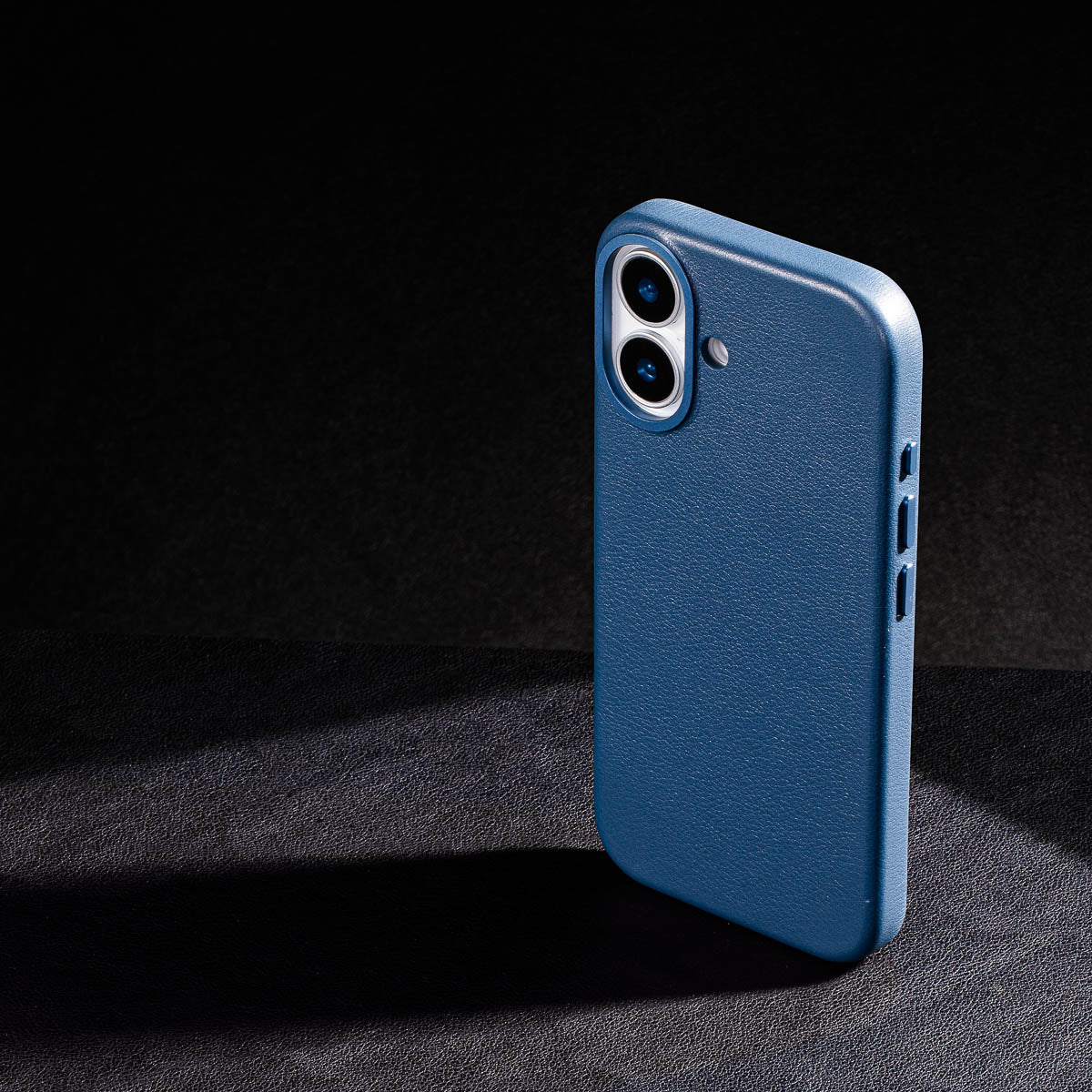 iphone 17 leather case in steel blue Ð raised camera ring and colour matched metal buttons detailing
