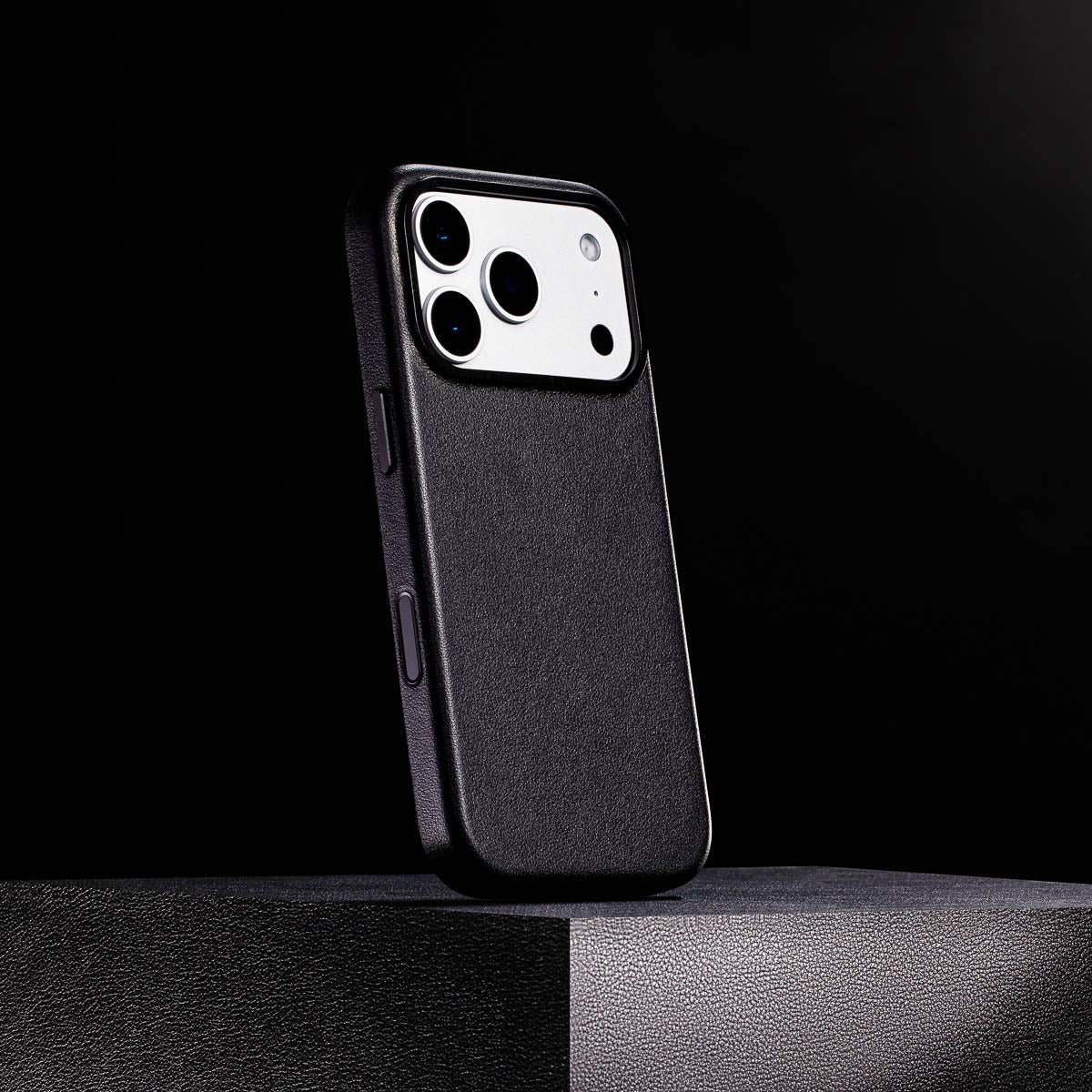 close up of obsidian black leather case for iphone 17 pro max showing full grain italian leather texture