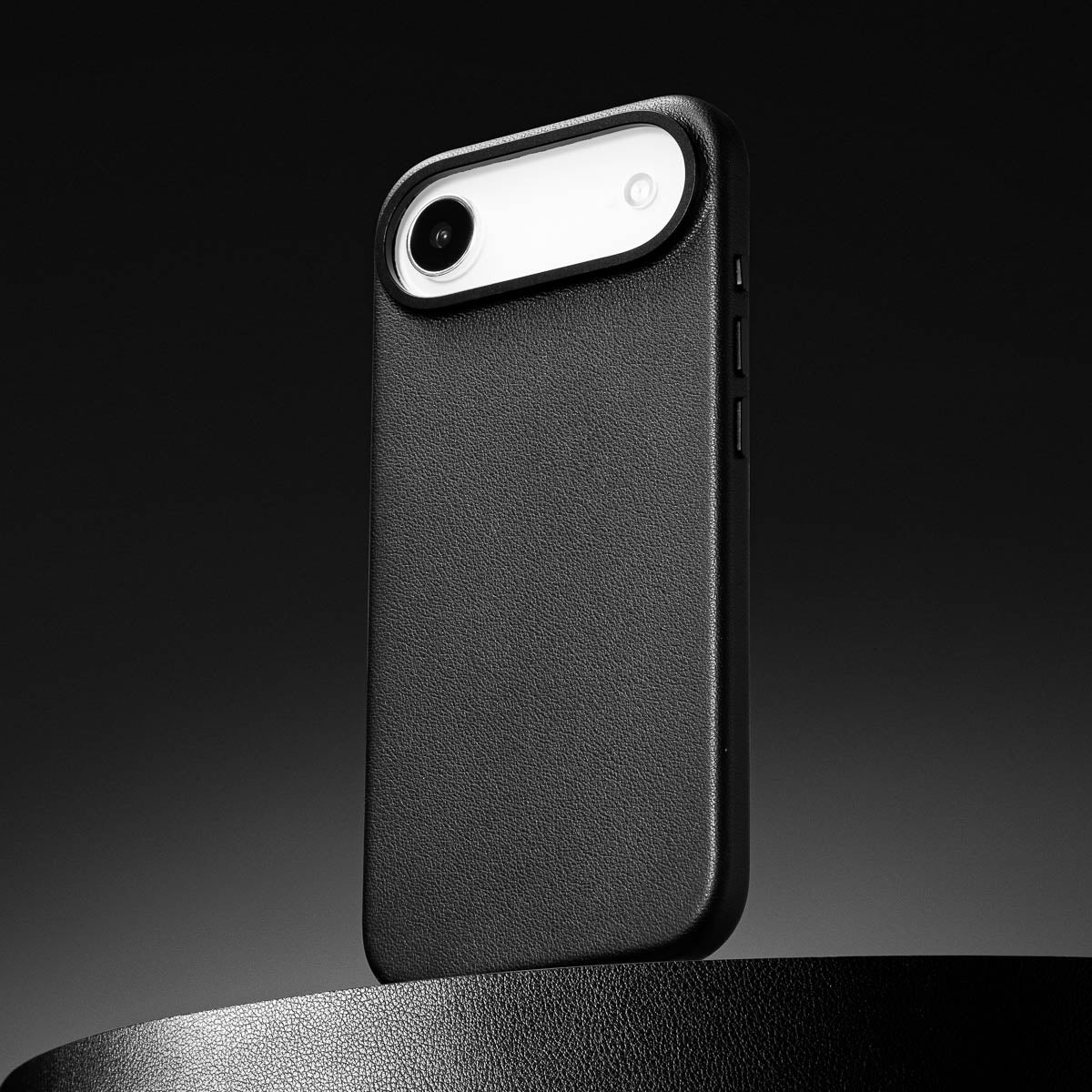 close up of obsidian black leather case for iphone air max showing full grain italian leather texture