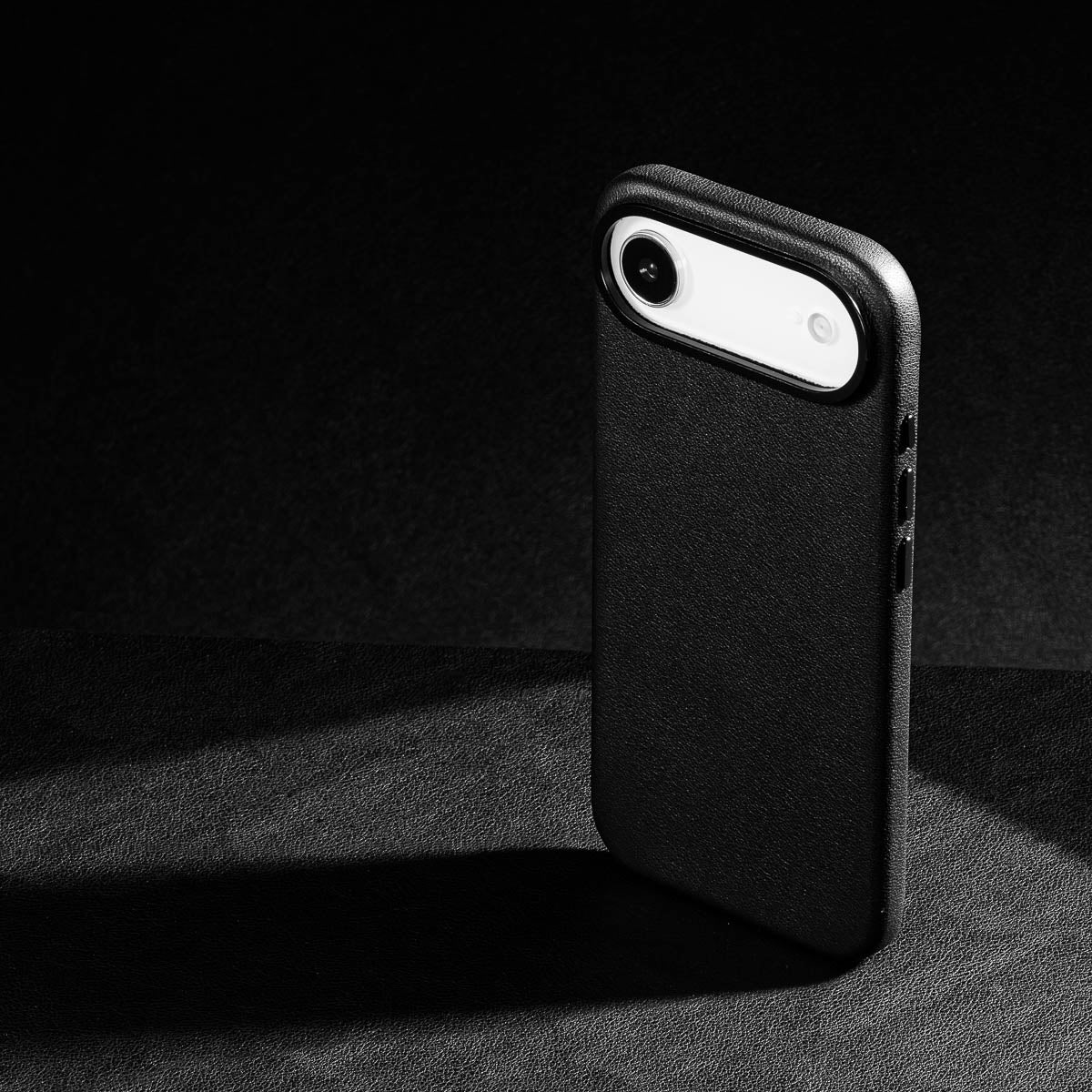 iphone air leather case in obsidian black Ð raised camera ring and colour matched metal buttons detailing