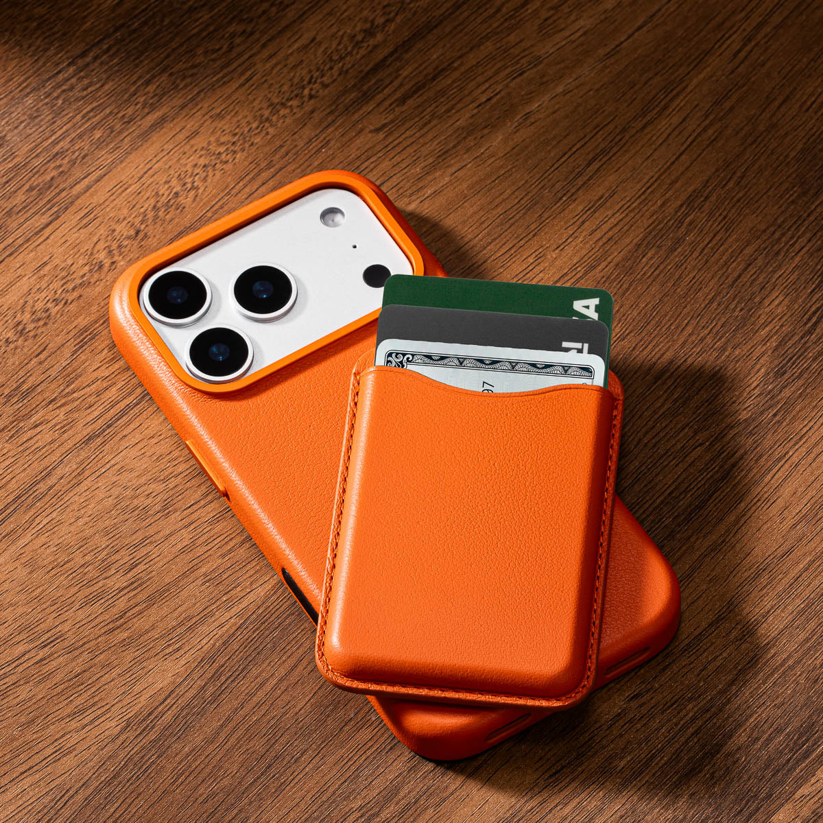 Solar Orange leather MagSafe wallet showing slim profile and compact design